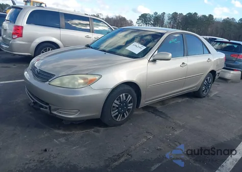 2004 Toyota Camry Le z USA, uszkodzony, nr VIN JTDBE32K540297668